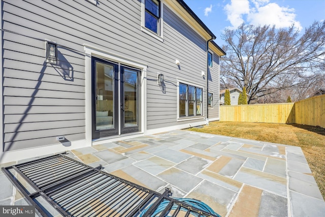 view of patio / terrace featuring fence