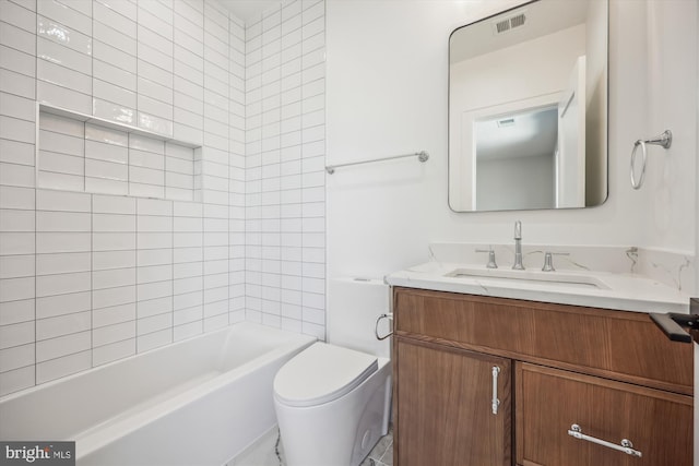 bathroom featuring vanity, toilet, and visible vents