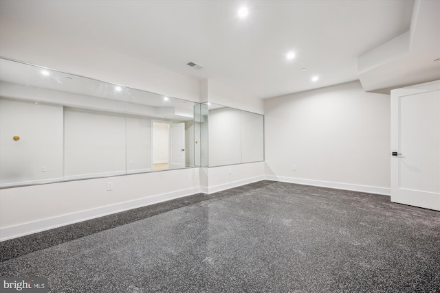 finished basement featuring visible vents, recessed lighting, and baseboards