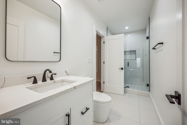 bathroom with tile patterned flooring, a shower stall, baseboards, toilet, and vanity