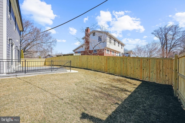 view of yard featuring a fenced backyard