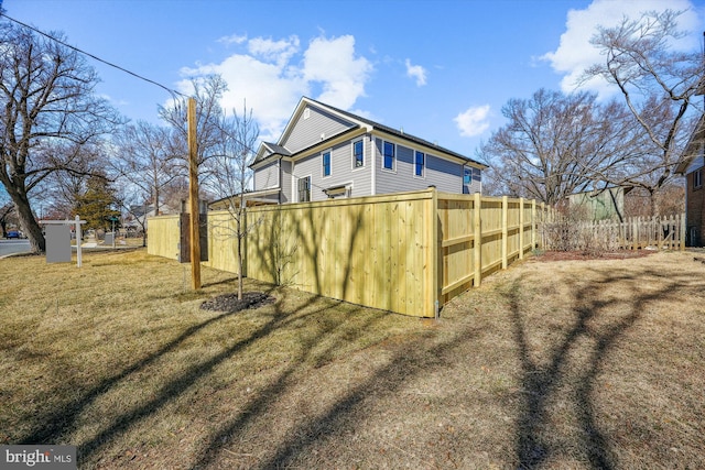 exterior space featuring a yard and fence