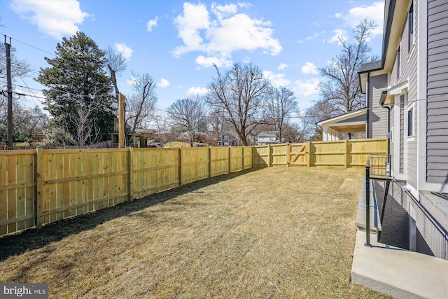 view of yard with a fenced backyard