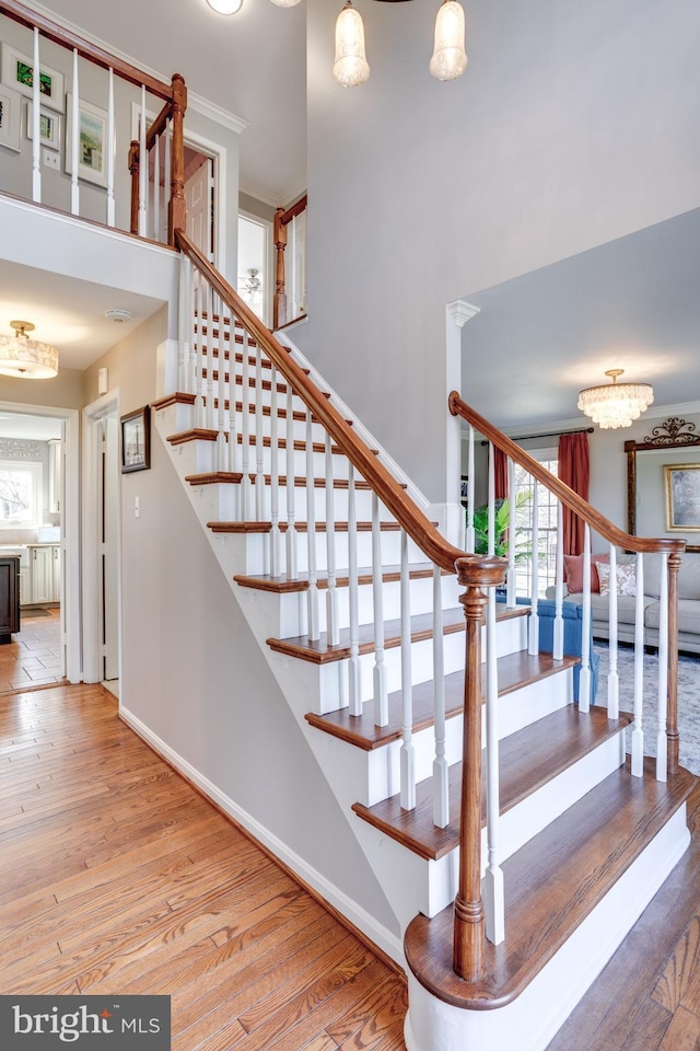 stairs with hardwood / wood-style flooring and baseboards