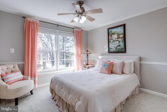 bedroom with baseboards, carpet floors, a ceiling fan, and crown molding