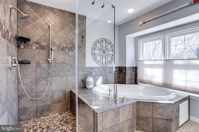 full bath featuring tiled shower and a bath