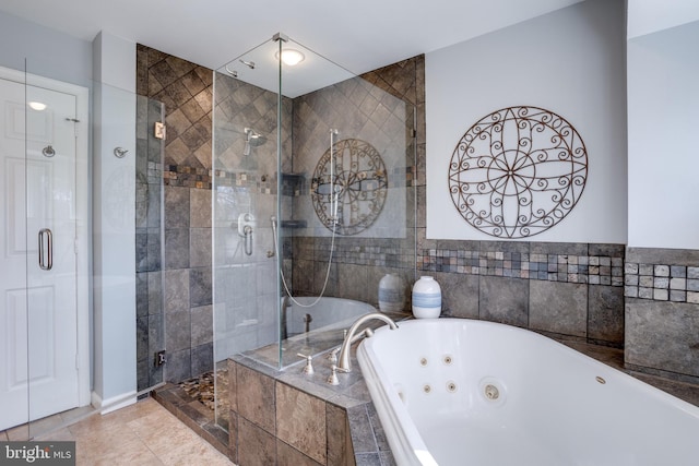 full bath with a whirlpool tub, tile patterned flooring, and a shower stall