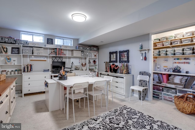 kitchen with a breakfast bar area, white cabinetry, open shelves, and light countertops