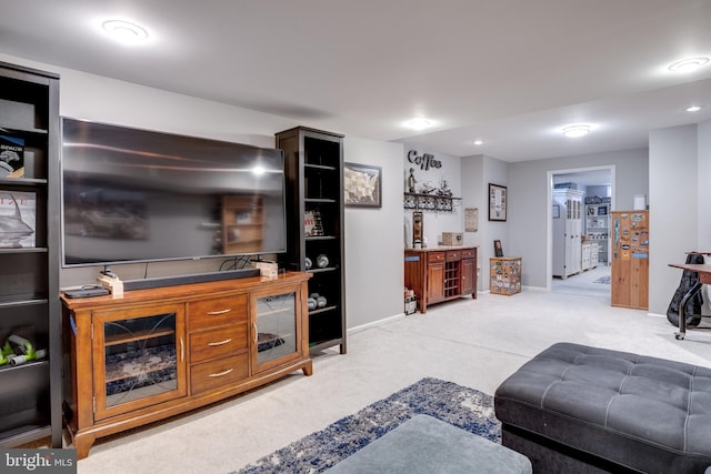 living room with carpet floors and baseboards