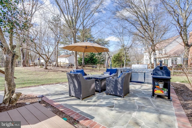 view of patio featuring fence and grilling area