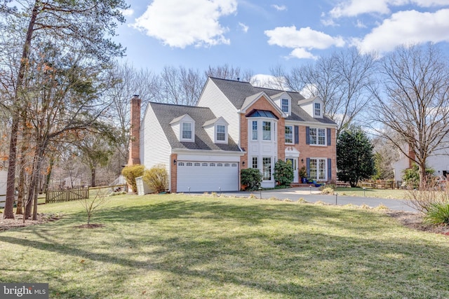 view of front of home featuring a chimney, a shingled roof, a front yard, fence, and driveway