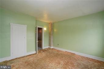 unfurnished bedroom with carpet and baseboards