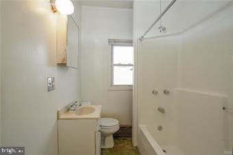 bathroom featuring shower / bathing tub combination, vanity, and toilet