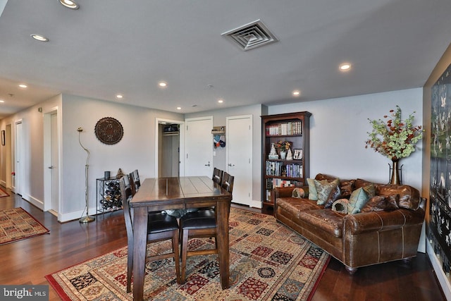 dining space featuring dark wood-style floors, baseboards, visible vents, and recessed lighting