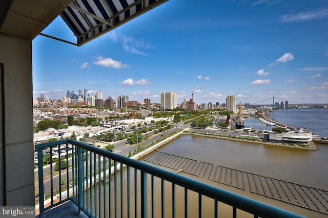 balcony with a water view and a city view