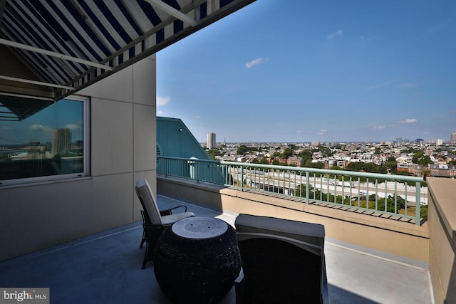 balcony featuring a view of city