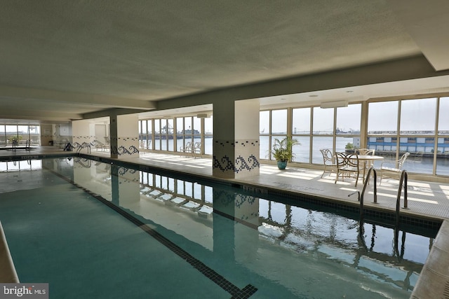 pool with a water view and a sink