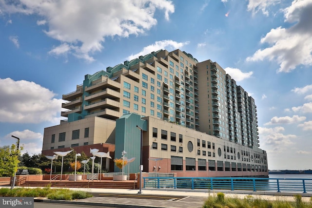 view of building exterior with a water view