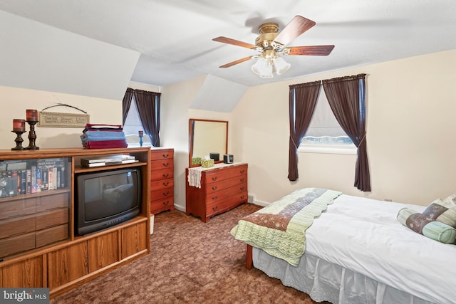 carpeted bedroom with a ceiling fan, lofted ceiling, and baseboards