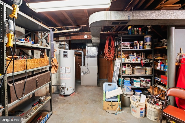 unfinished below grade area with gas water heater and heating unit