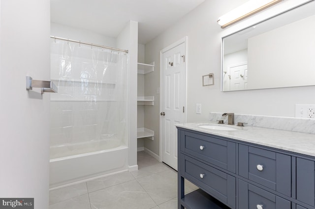 full bath with tile patterned flooring, shower / bath combo with shower curtain, and vanity