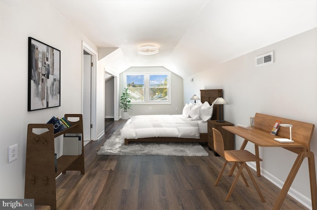 bedroom featuring baseboards, visible vents, vaulted ceiling, and dark wood finished floors