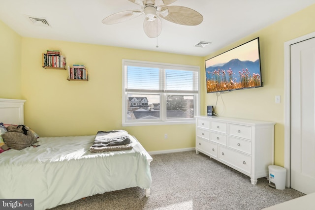 bedroom featuring light carpet, ceiling fan, visible vents, and baseboards