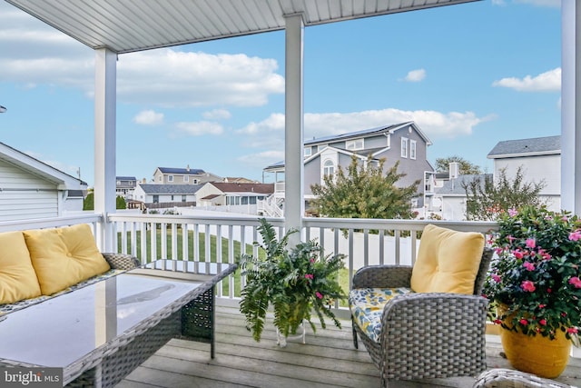 wooden terrace with a residential view