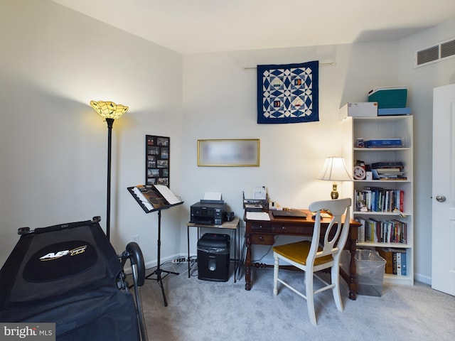 home office featuring carpet floors, baseboards, and visible vents