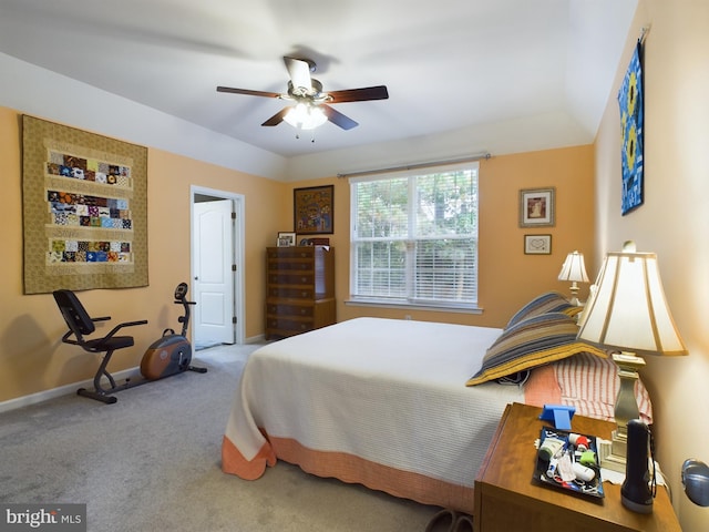 carpeted bedroom featuring a ceiling fan and baseboards