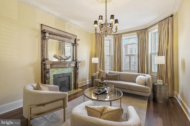 living area with baseboards, a fireplace, ornamental molding, and dark wood-type flooring