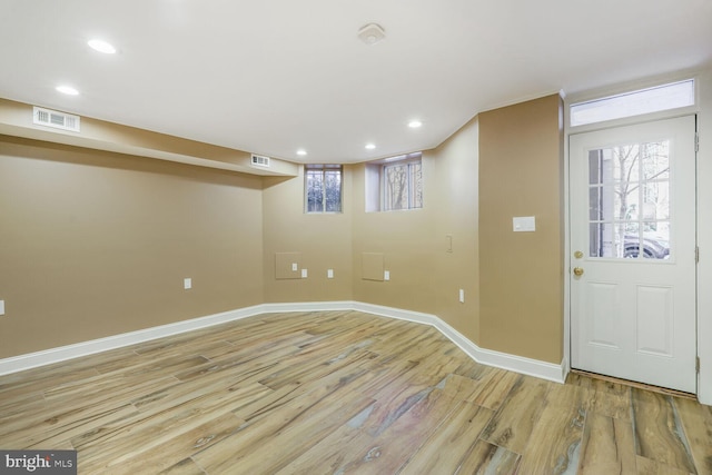 foyer entrance featuring light wood-style floors, visible vents, baseboards, and recessed lighting