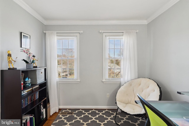 living area featuring wood finished floors, baseboards, and ornamental molding