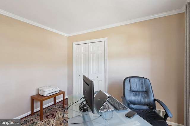 home office featuring wood finished floors, baseboards, and ornamental molding