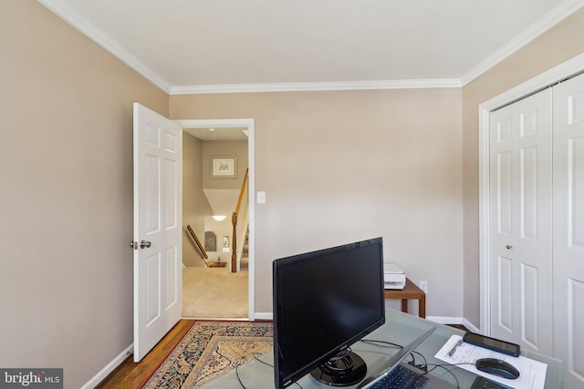 office featuring wood finished floors, baseboards, and ornamental molding