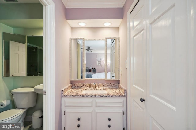 ensuite bathroom with visible vents, connected bathroom, vanity, and toilet