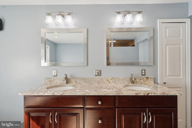 bathroom featuring double vanity and a sink