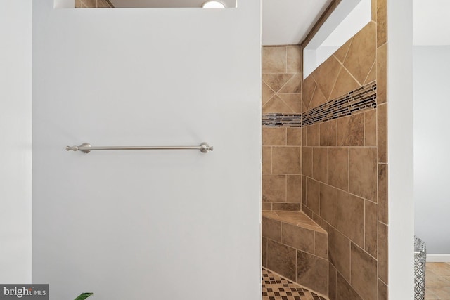 bathroom featuring tiled shower