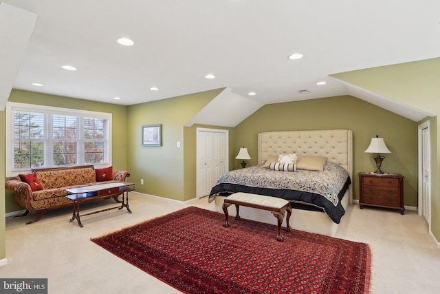 bedroom with a closet, vaulted ceiling, recessed lighting, and carpet floors