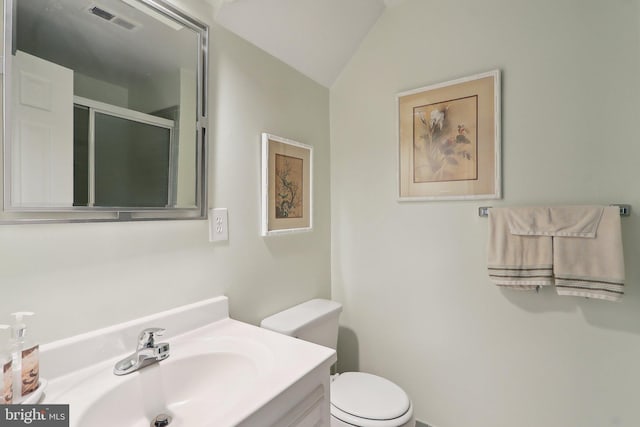 full bathroom with vanity, visible vents, a shower stall, vaulted ceiling, and toilet