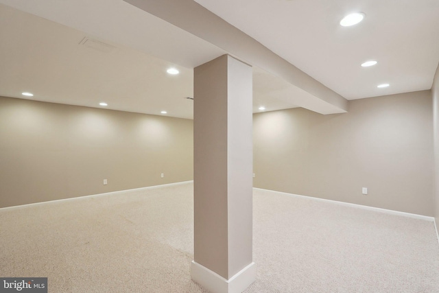 finished below grade area featuring recessed lighting, baseboards, and carpet