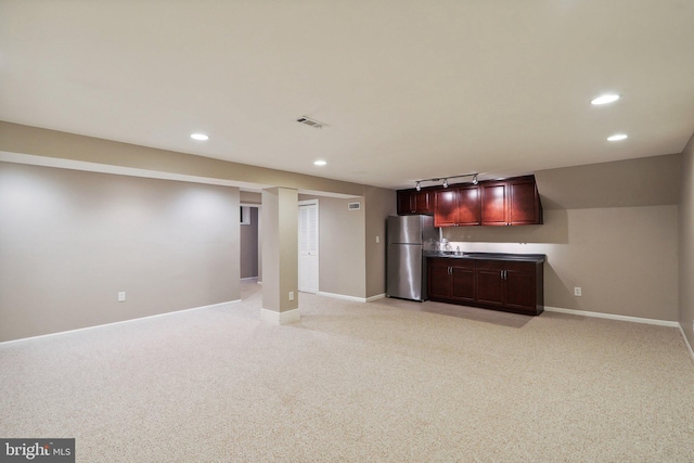 kitchen with light carpet, recessed lighting, freestanding refrigerator, and baseboards