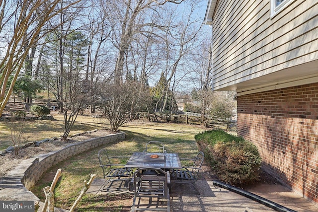 view of patio featuring outdoor dining area