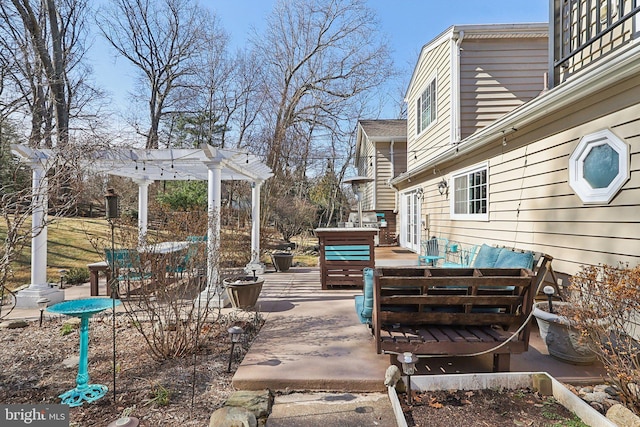 view of patio / terrace featuring an outdoor living space and a pergola