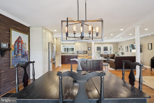 dining room with a chandelier, recessed lighting, light wood-style flooring, and crown molding