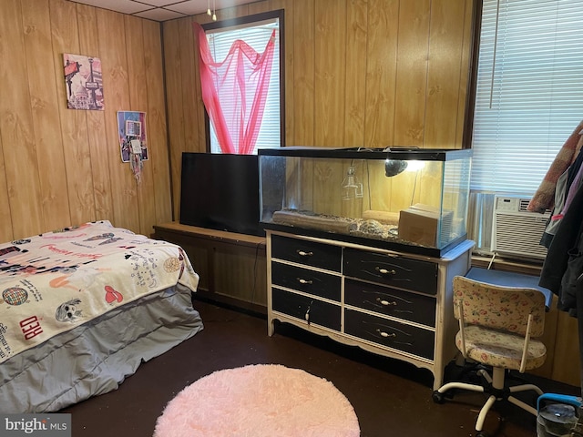 bedroom featuring wood walls and cooling unit