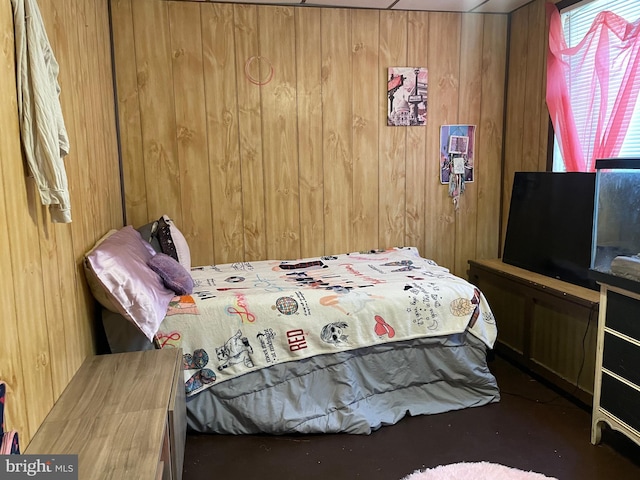 bedroom with wooden walls