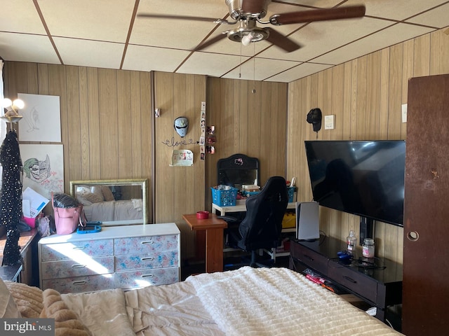 bedroom with wood walls