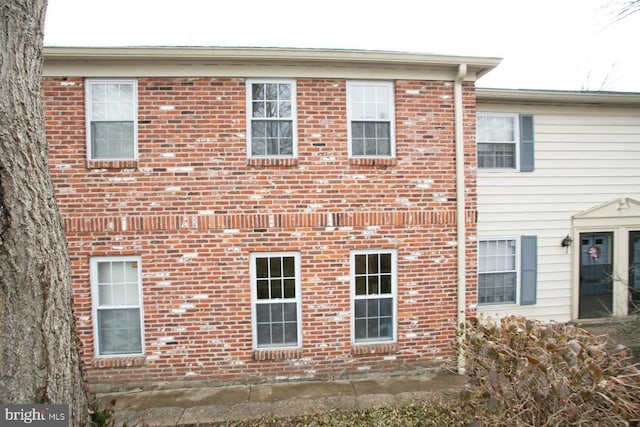 exterior space featuring brick siding