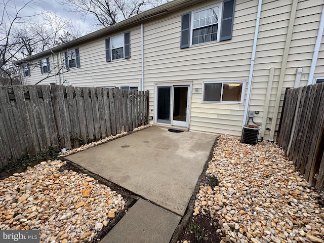 back of property with a patio and fence